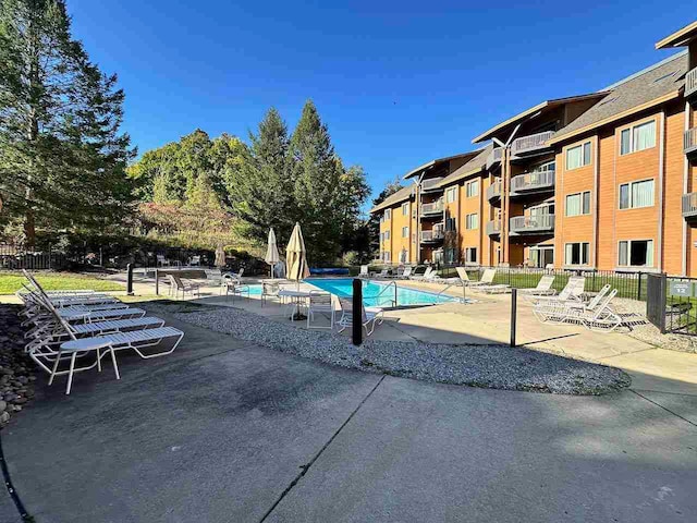 view of swimming pool featuring a patio area