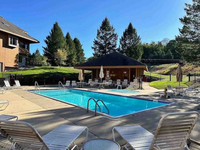 view of swimming pool with a patio area