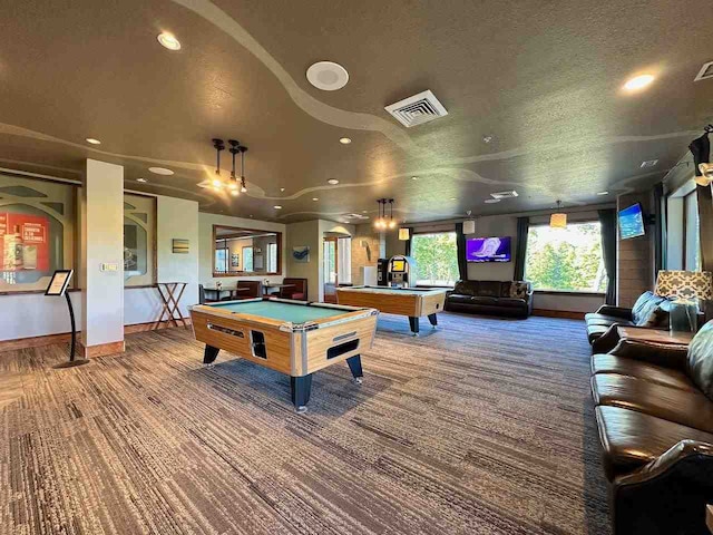 rec room with carpet flooring, a textured ceiling, and pool table