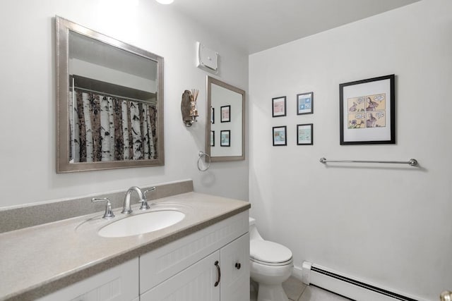 bathroom with tile patterned flooring, baseboard heating, vanity, and toilet