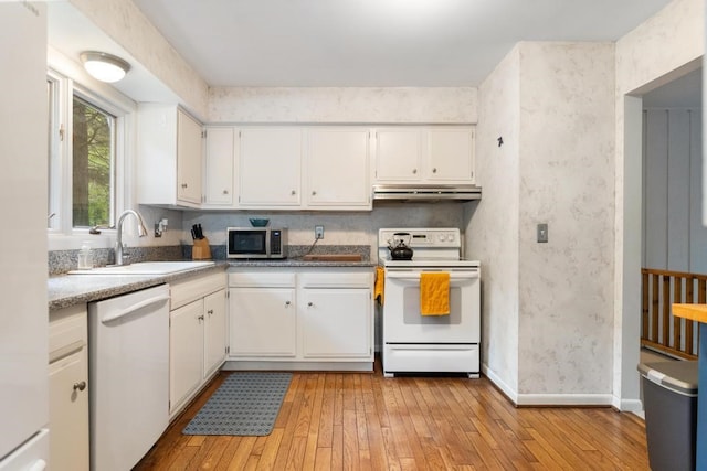 kitchen featuring light hardwood / wood-style flooring, sink, white appliances, and white cabinetry