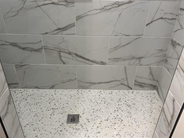 details featuring a tile shower