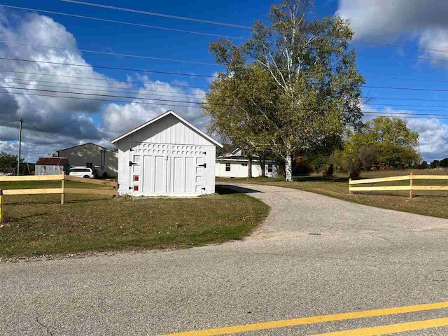 view of outbuilding featuring a yard