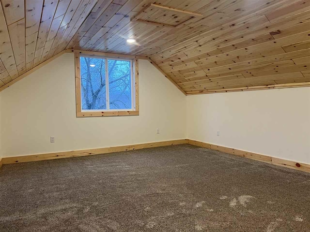 bonus room with wood ceiling and vaulted ceiling