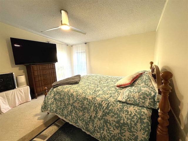 bedroom with a textured ceiling, carpet floors, ceiling fan, and lofted ceiling