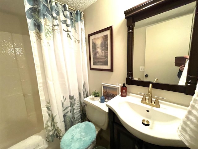 full bathroom with vanity, shower / bath combination with curtain, a textured ceiling, and toilet