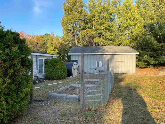 view of outdoor structure featuring a lawn