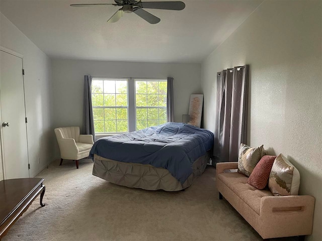 bedroom featuring lofted ceiling, carpet, and ceiling fan