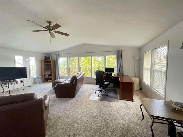 office area with lofted ceiling, ceiling fan, and light colored carpet