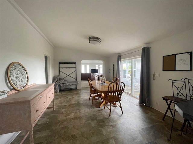 dining area with vaulted ceiling