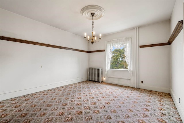 unfurnished room featuring a notable chandelier and radiator