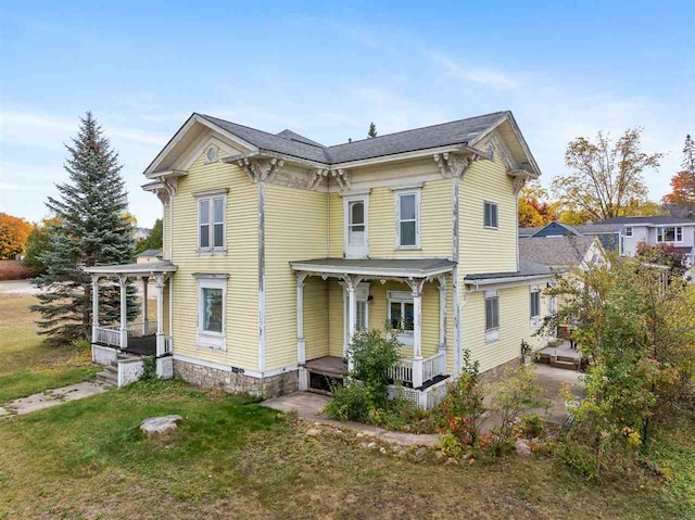 exterior space with a yard and a porch