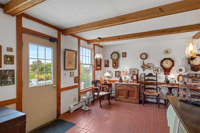 interior space featuring beam ceiling and a baseboard heating unit