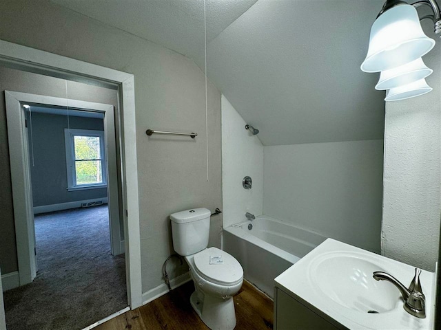 full bathroom with vanity, toilet, a textured ceiling, shower / bathtub combination, and vaulted ceiling