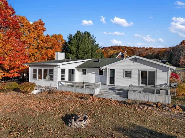 rear view of house with a wooden deck