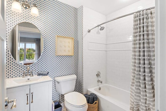 full bathroom featuring toilet, vanity, and shower / bathtub combination with curtain