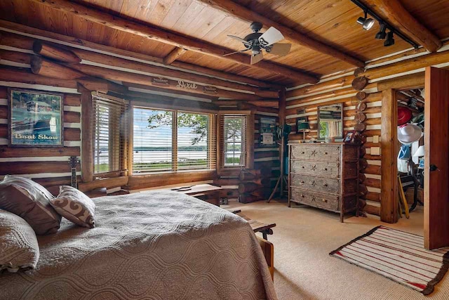 bedroom with ceiling fan, beamed ceiling, wood ceiling, and rustic walls