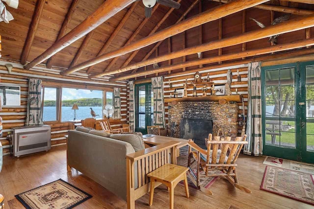 living room featuring wooden ceiling, a water view, lofted ceiling with beams, a fireplace, and light hardwood / wood-style floors