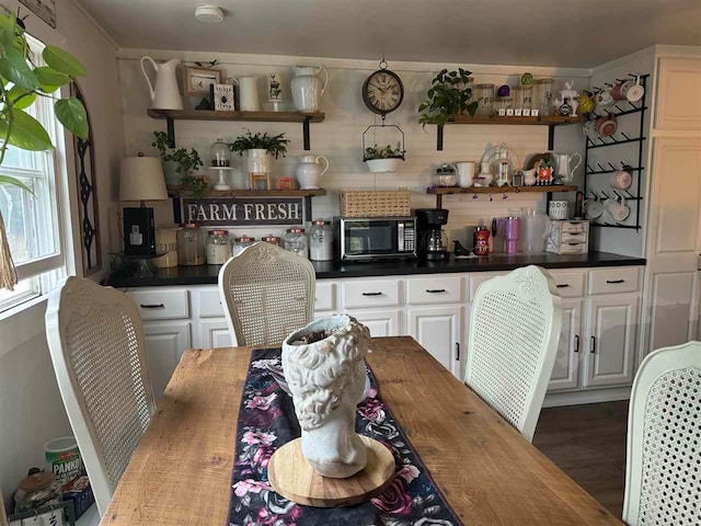 dining area featuring dark hardwood / wood-style flooring