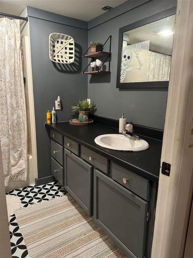 bathroom featuring vanity and walk in shower