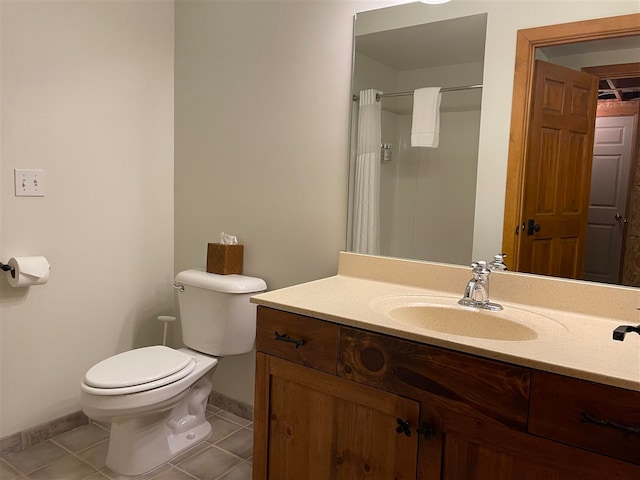 bathroom with toilet, curtained shower, vanity, and tile patterned floors