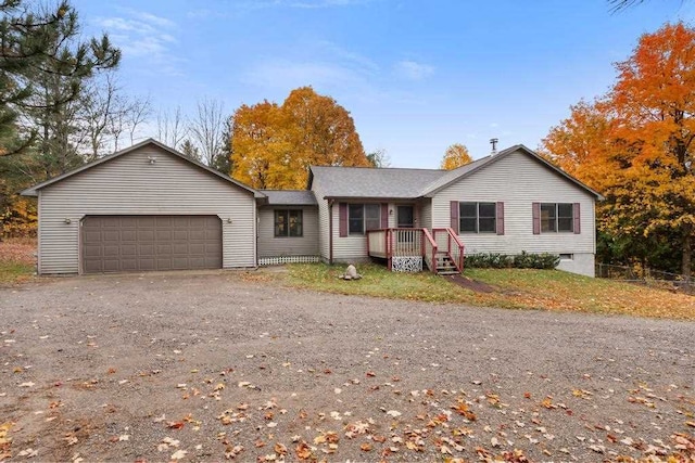 ranch-style house featuring a garage