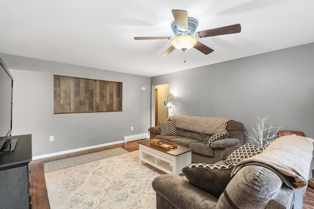 living room featuring a baseboard radiator, wood-type flooring, and ceiling fan