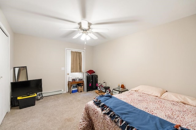 carpeted bedroom featuring a baseboard radiator and ceiling fan