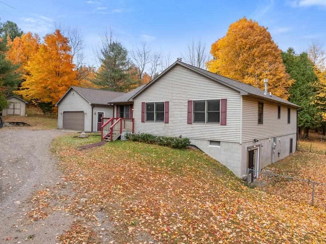 view of front of property with a shed