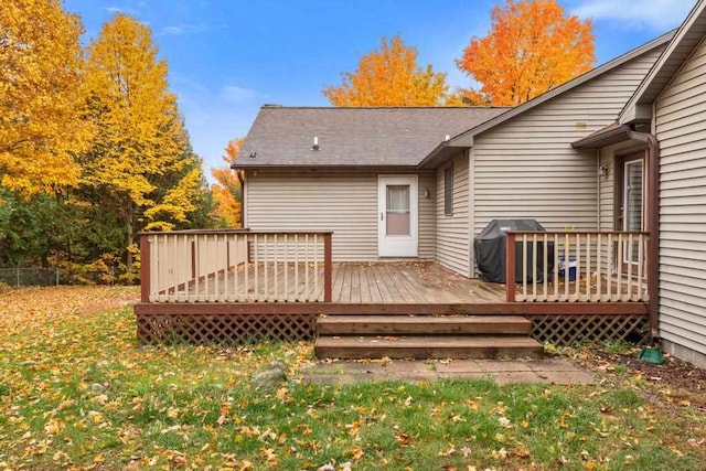 wooden deck featuring area for grilling