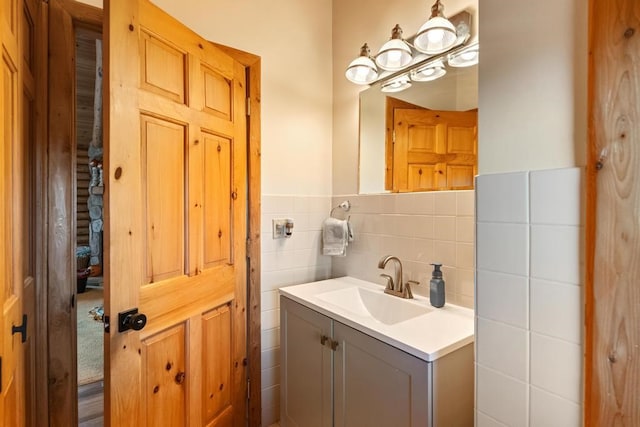 bathroom with tile walls and vanity