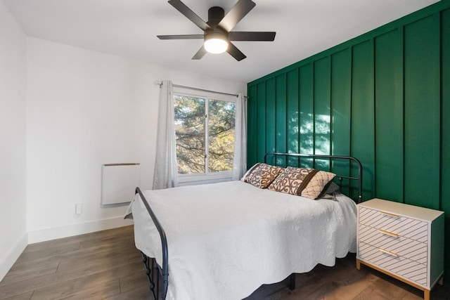 bedroom featuring dark hardwood / wood-style flooring and ceiling fan