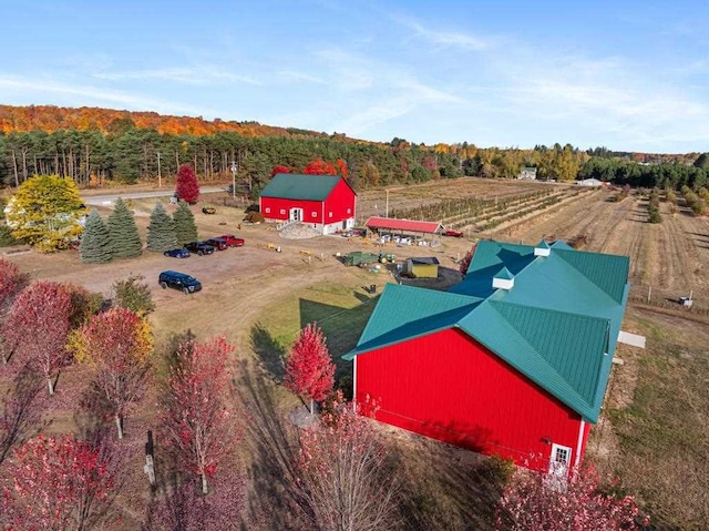 birds eye view of property with a rural view