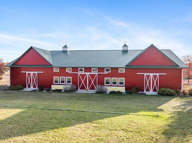 view of outbuilding featuring a yard