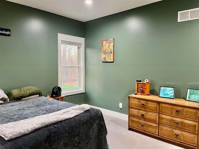 bedroom featuring light colored carpet