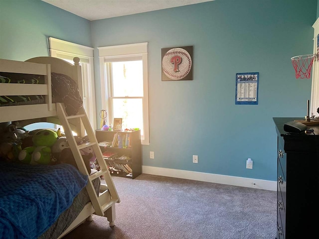 carpeted bedroom featuring a textured ceiling