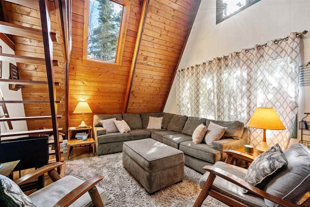 living room with vaulted ceiling with beams, wood walls, hardwood / wood-style flooring, and wooden ceiling