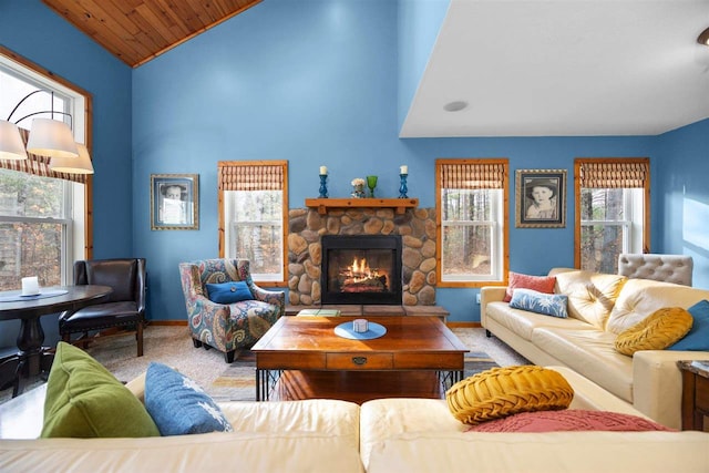 carpeted living room with wood ceiling, high vaulted ceiling, and a fireplace