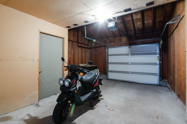 1185 Hideaway Valley Dr Unit 5, Harbor Springs, MI 49740 - garage with a garage door opener