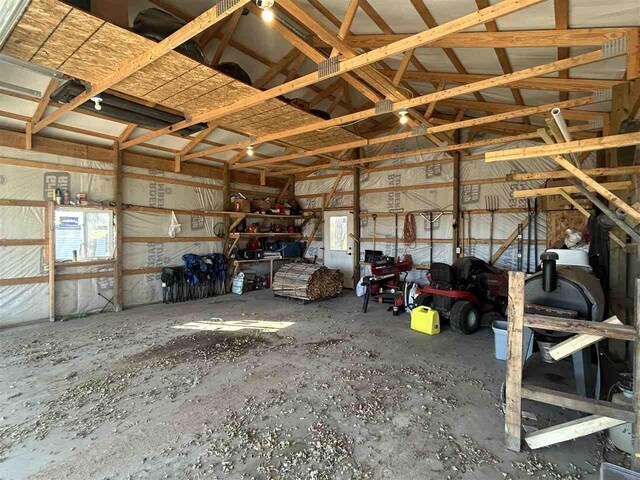 5157 Graham Rd, East Jordan, MI 49727 - misc room featuring lofted ceiling and a garage