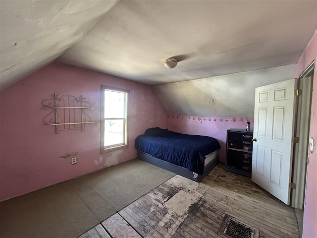 5157 Graham Rd, East Jordan, MI 49727 - bedroom with lofted ceiling and visible vents