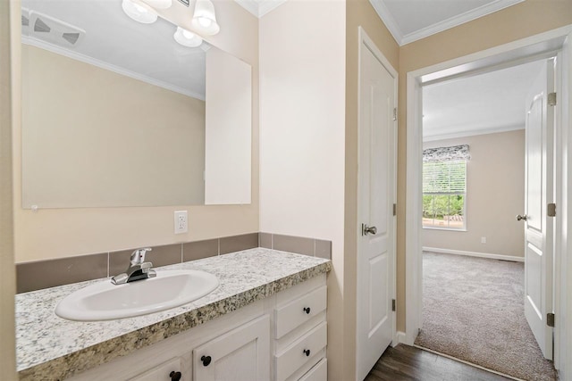 bathroom with vanity and ornamental molding