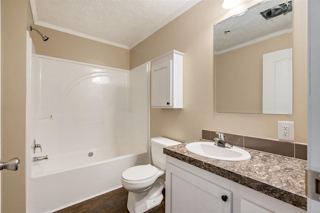 bathroom featuring toilet, vanity, crown molding, and a textured ceiling