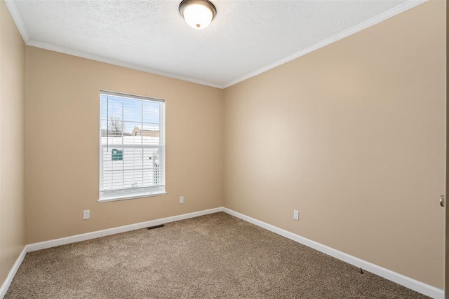 spare room with carpet flooring, baseboards, and ornamental molding
