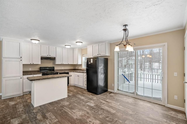 kitchen with a textured ceiling, black appliances, white cabinetry, and under cabinet range hood