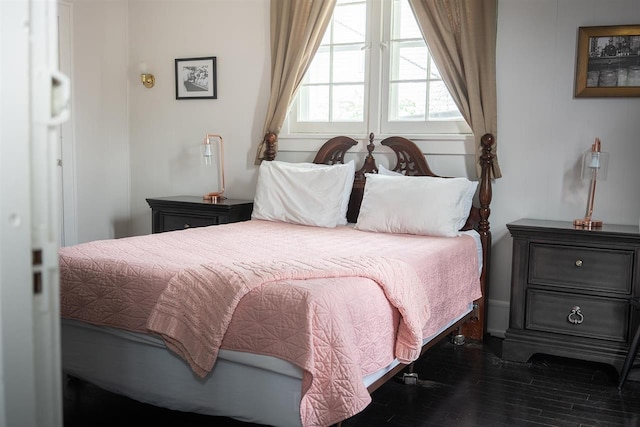 bedroom featuring dark hardwood / wood-style flooring