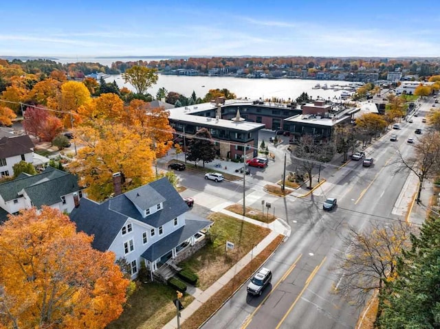 birds eye view of property with a water view