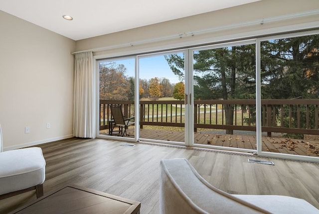 doorway to outside with hardwood / wood-style floors