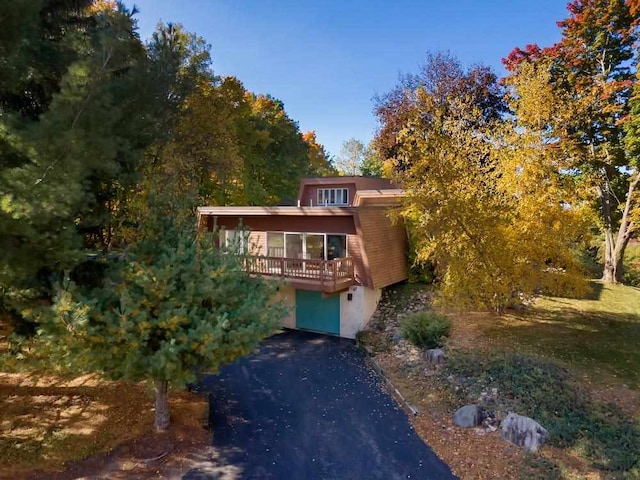 view of front of house featuring a sunroom