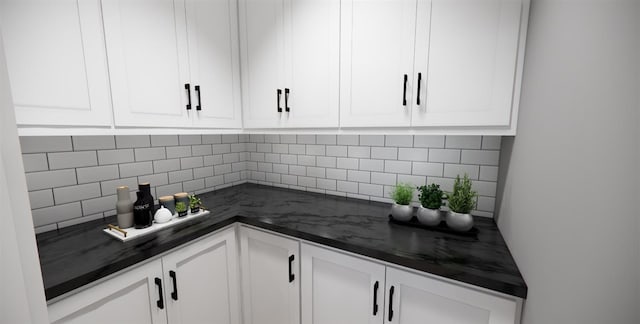 kitchen featuring white cabinetry and backsplash